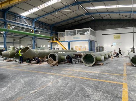 Manufacturing facility with large pipes